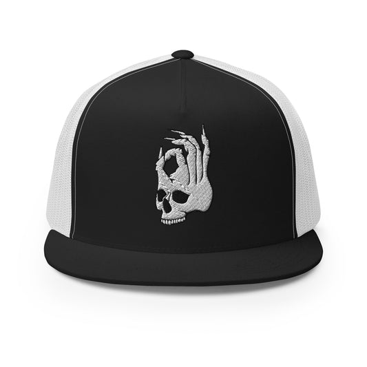 Front view of the Hellbeing skull embroidered 5 panel black and white trucker hat